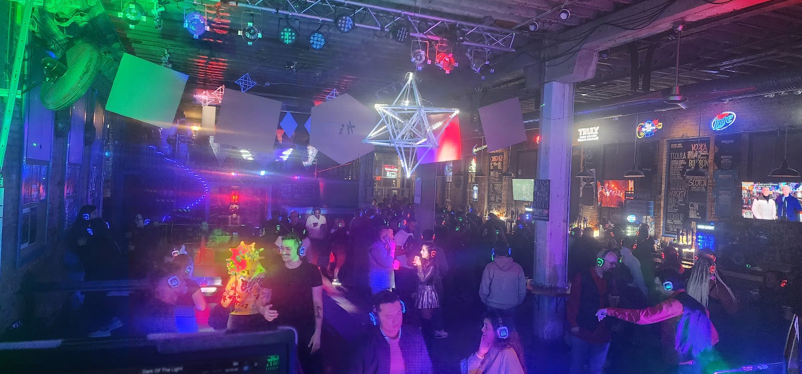SE2 Silent Disco photo showing guests wearing glowing wireless headphones with dance-floor energy, asset 3MVXCK.