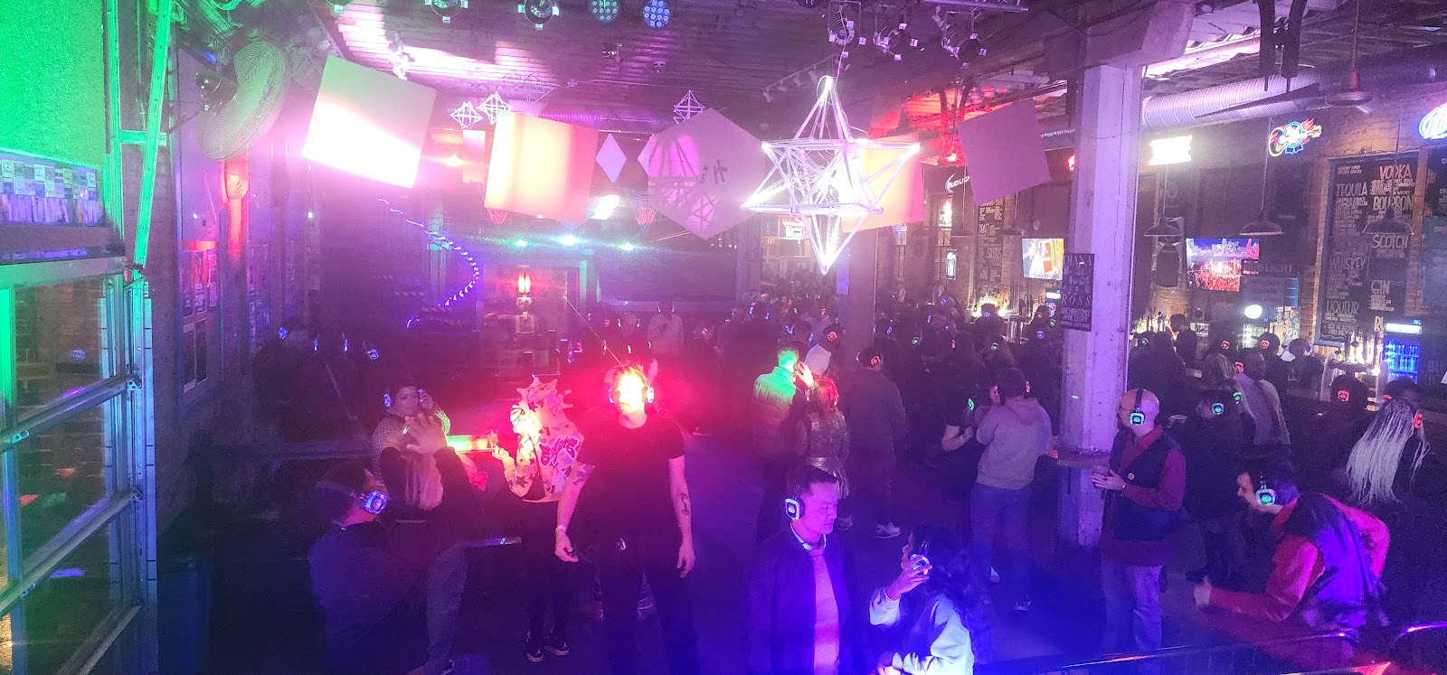 SE2 Silent Disco photo showing glowing headphones and event energy with party lighting, asset 4DK1T8.