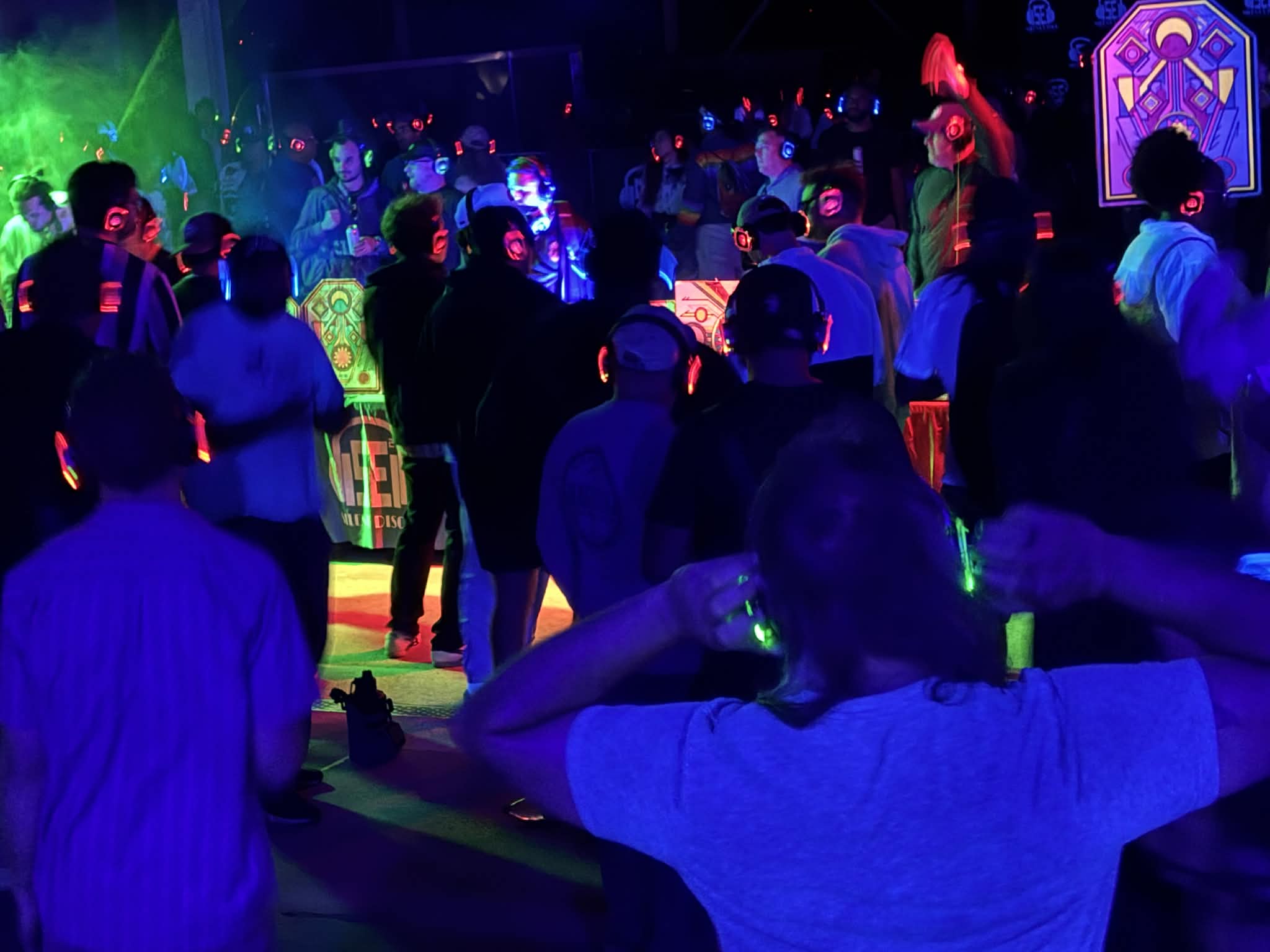 SE2 silent disco crowd with glowing headphones